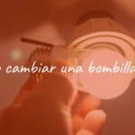 A hand replacing an LED light bulb in a ceiling socket, bright illumination, step-by-step DIY guide vibe, realistic.