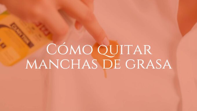 Close-up of a hand removing a grease stain from a white shirt using a cleaning spray, bright and clean background, realistic.